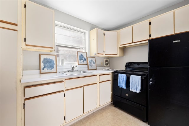 kitchen with sink and black appliances