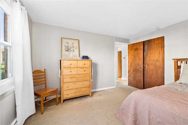 carpeted bedroom featuring a closet