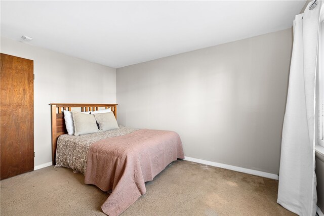 bedroom with light carpet