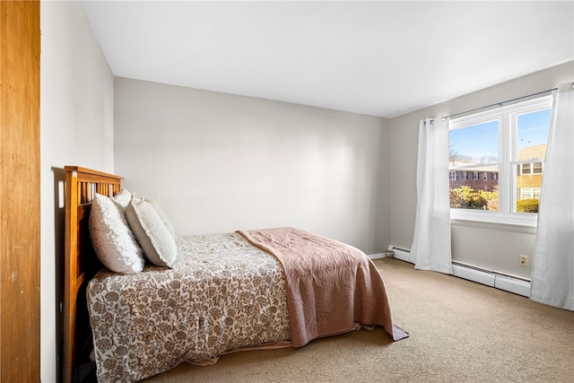 carpeted bedroom featuring a baseboard radiator