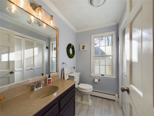 bathroom featuring baseboard heating, vanity, crown molding, and toilet