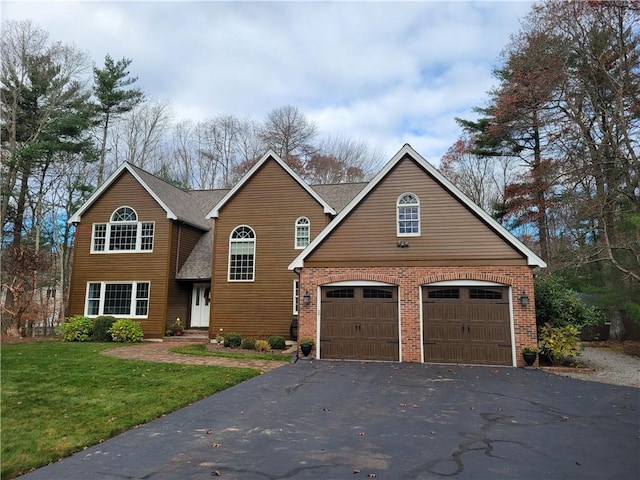 front facade featuring a garage and a front yard