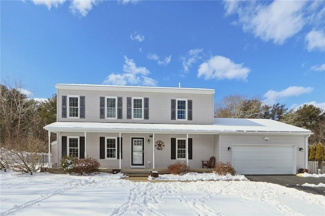 view of front property with a garage and covered porch