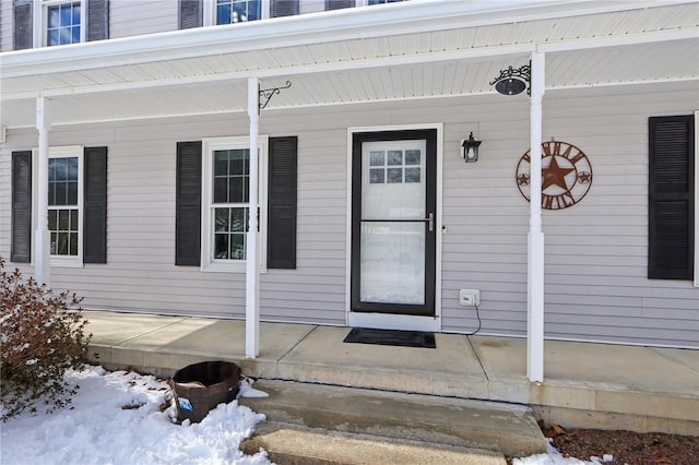 view of snow covered property entrance