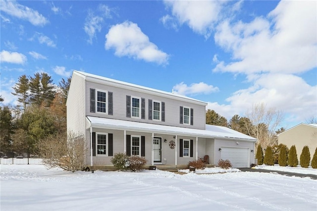 view of front of property with a garage and covered porch