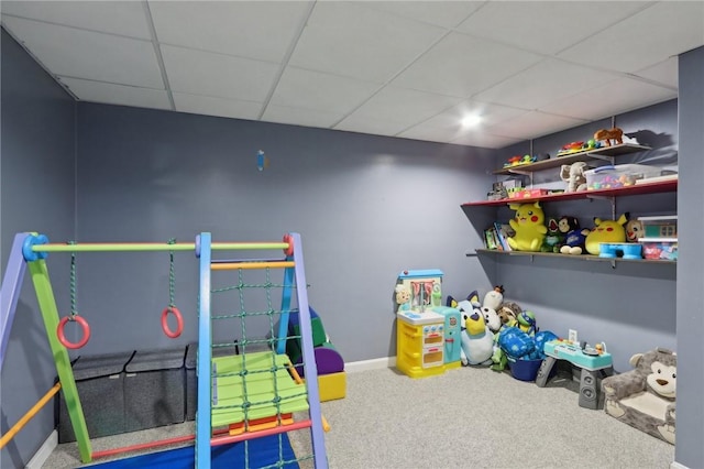 game room featuring carpet floors and a drop ceiling