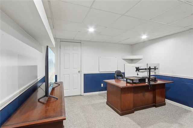 office area featuring carpet and a drop ceiling