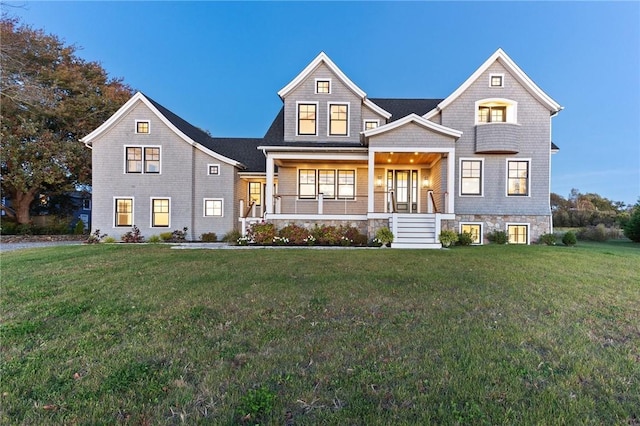 view of front facade with a porch and a front yard