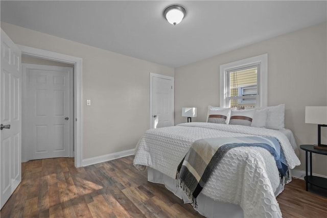 bedroom featuring dark hardwood / wood-style flooring