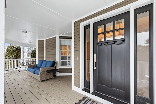 entrance to property featuring a porch