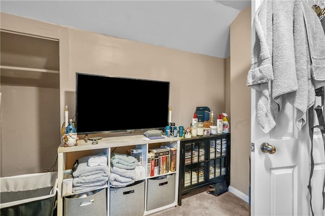 carpeted bedroom featuring vaulted ceiling