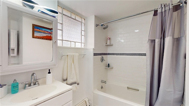 bathroom with shower / bath combo, a baseboard heating unit, and vanity