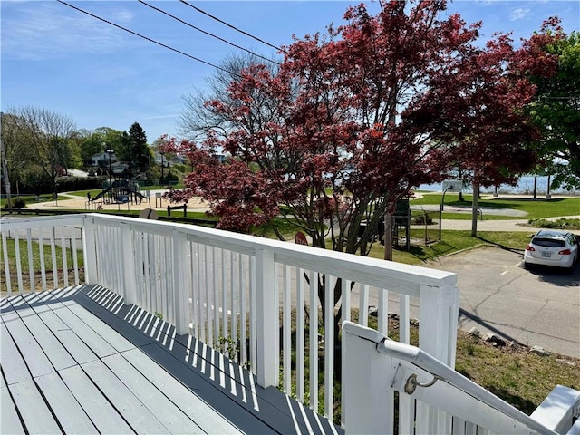 wooden terrace with a playground