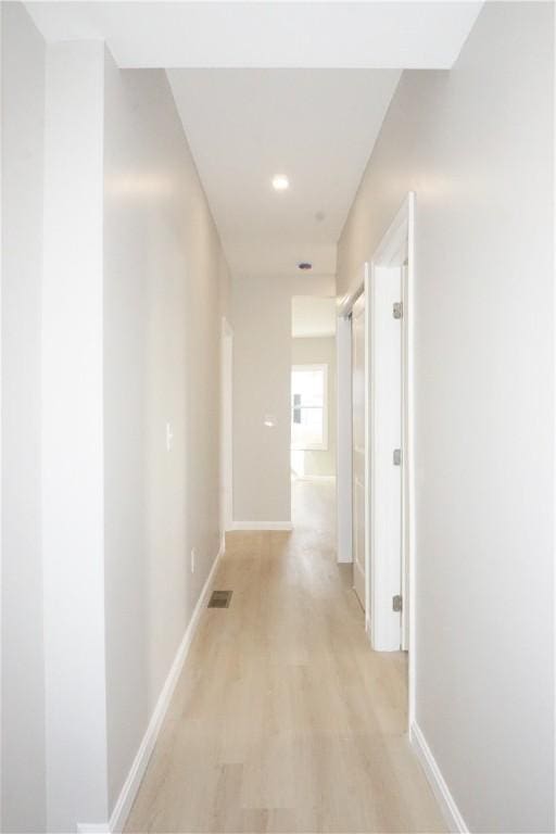 hallway featuring light hardwood / wood-style flooring