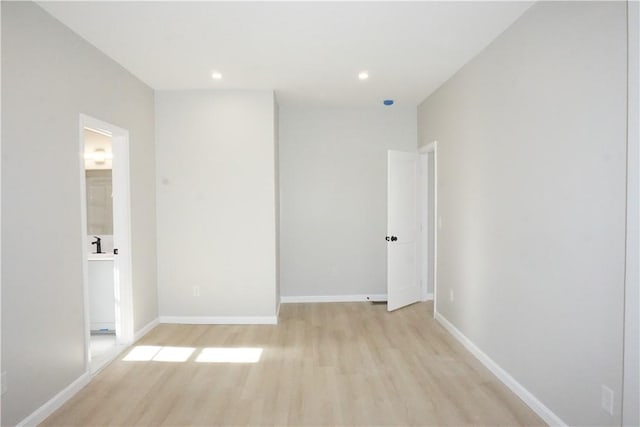 spare room with light wood-type flooring