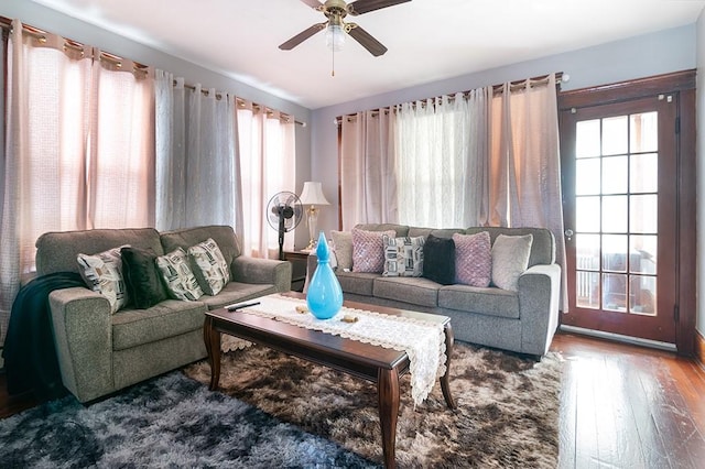 living room with ceiling fan, hardwood / wood-style flooring, and a healthy amount of sunlight