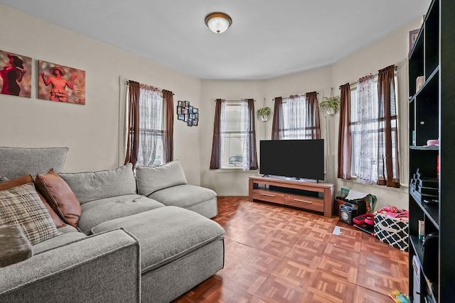 living room featuring parquet floors