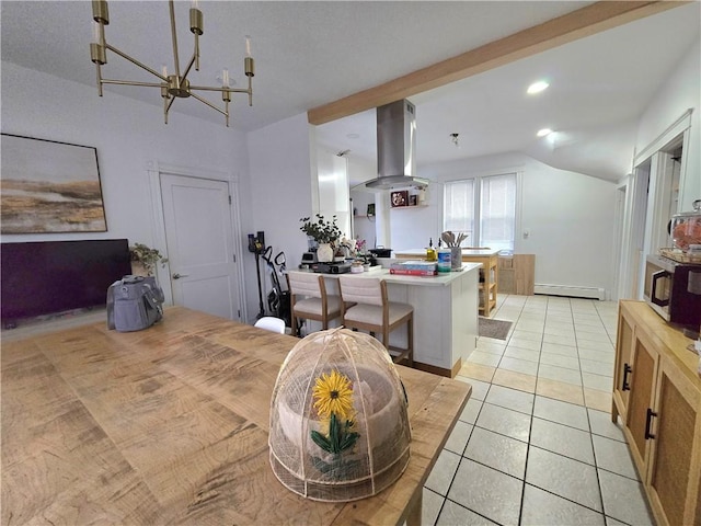 kitchen with a kitchen bar, island range hood, vaulted ceiling, light tile patterned floors, and baseboard heating