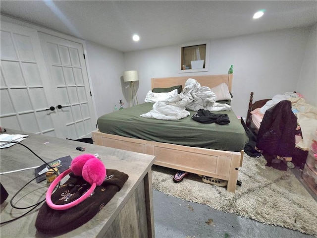 bedroom featuring concrete floors