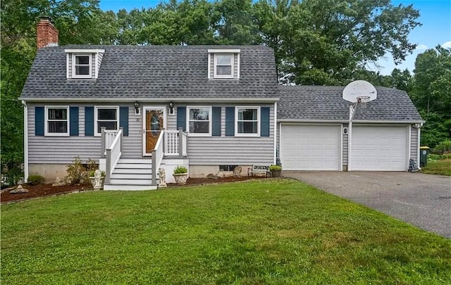 new england style home featuring a garage and a front yard