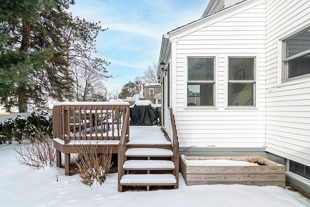 snow covered deck with area for grilling