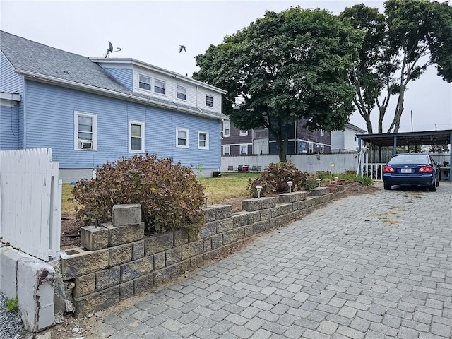 exterior space featuring a carport