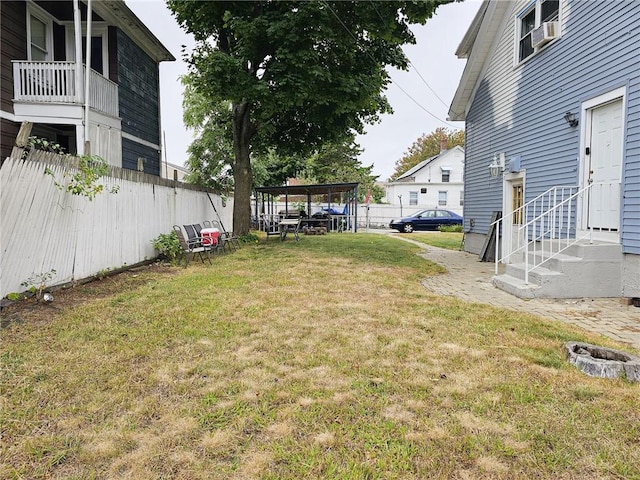 view of yard featuring a carport and cooling unit