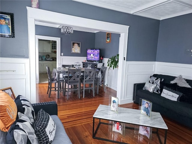 36 Utton Ave, Pawtucket, RI 02860 - living area with wainscoting, wood finished floors, ornamental molding, a decorative wall, and a chandelier