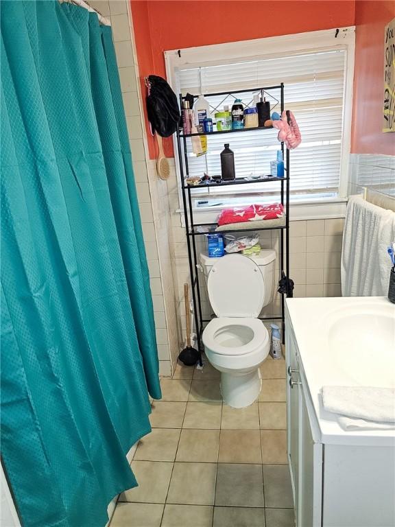 36 Utton Ave, Pawtucket, RI 02860 - full bath with tile walls, toilet, tile patterned floors, vanity, and curtained shower