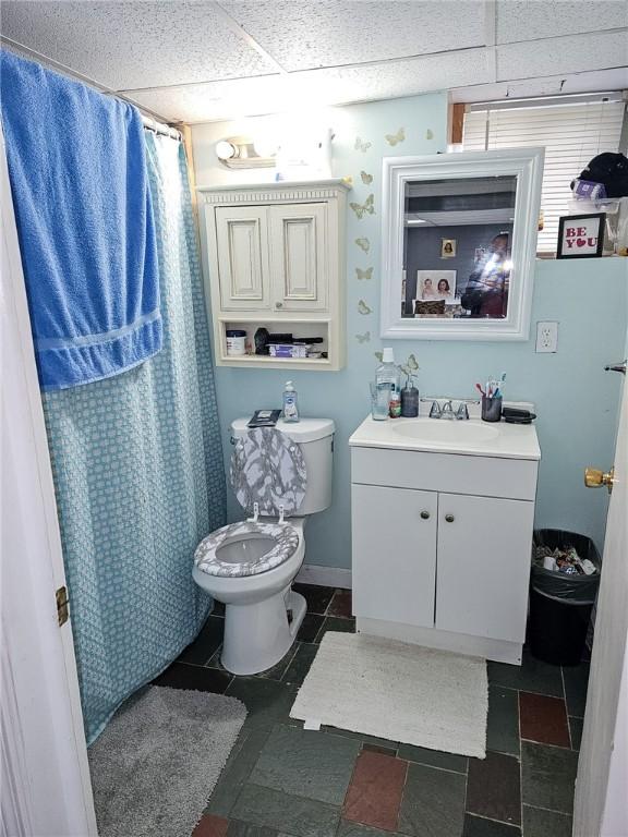 36 Utton Ave, Pawtucket, RI 02860 - full bathroom featuring vanity, toilet, and a shower with curtain