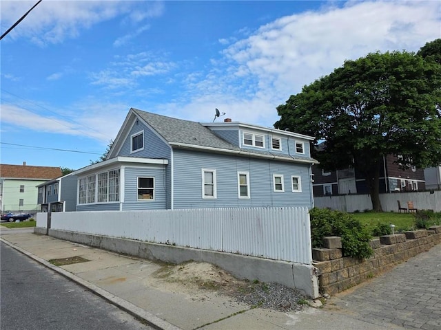 36 Utton Ave, Pawtucket, RI 02860 - view of side of property featuring roof with shingles
