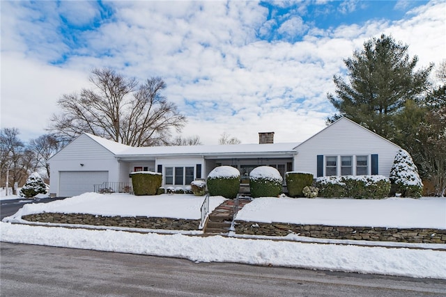 ranch-style home featuring a garage