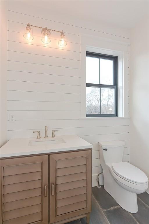 bathroom featuring vanity and toilet