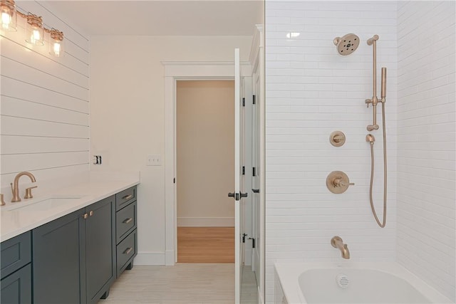 bathroom featuring vanity, separate shower and tub, and wood-type flooring