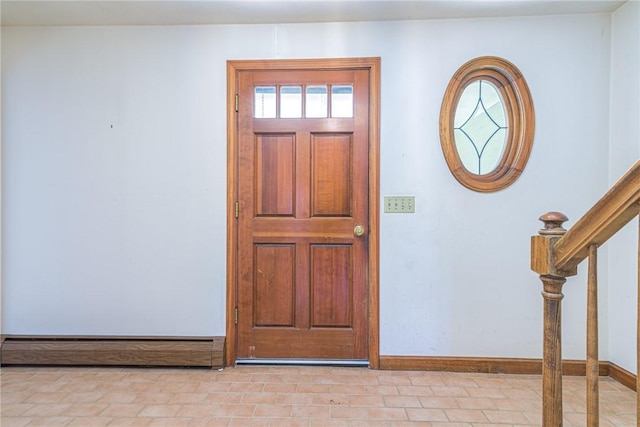 foyer entrance featuring baseboard heating