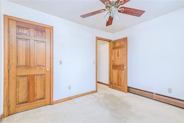 unfurnished bedroom with light colored carpet and ceiling fan