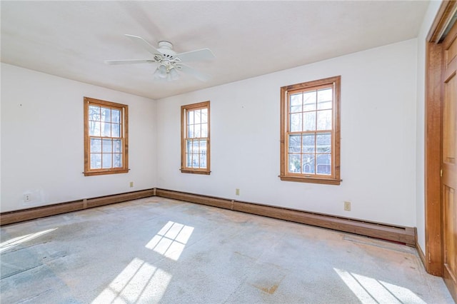 carpeted empty room featuring ceiling fan and a baseboard radiator