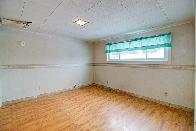 unfurnished room featuring hardwood / wood-style flooring