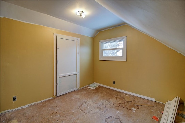 additional living space featuring vaulted ceiling