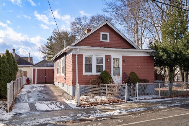 bungalow featuring a storage unit