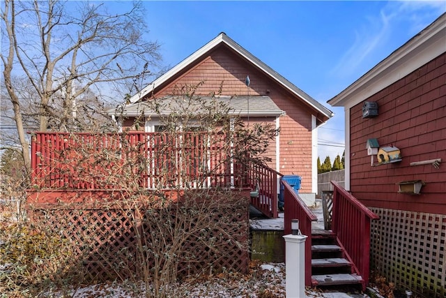 rear view of house featuring a deck