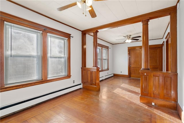 unfurnished room with light wood-type flooring, a baseboard radiator, ceiling fan, and ornate columns