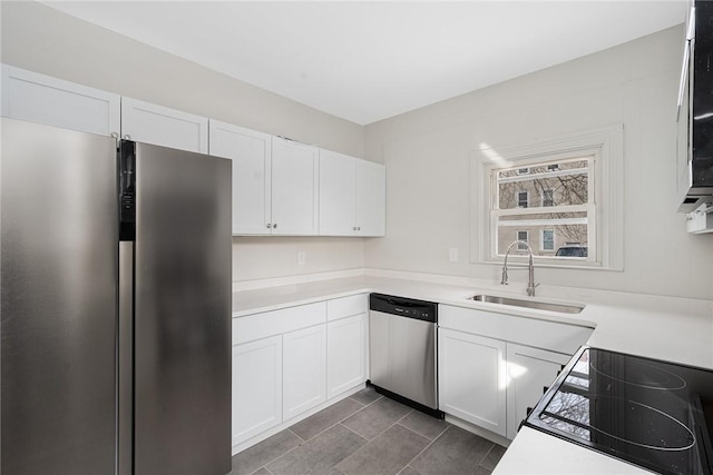 kitchen with white cabinetry, appliances with stainless steel finishes, and sink