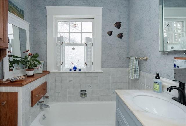 bathroom with vanity and a bathtub