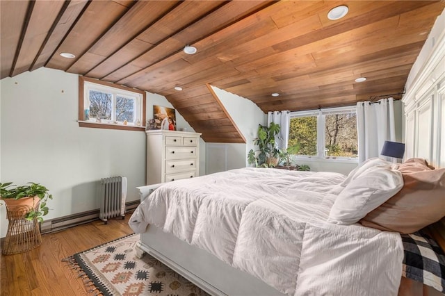 bedroom featuring wood ceiling, lofted ceiling, radiator heating unit, and light hardwood / wood-style flooring