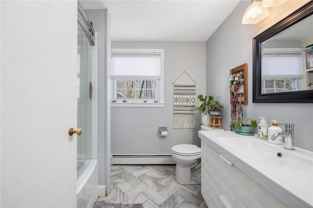 bathroom with vanity, a baseboard heating unit, and toilet