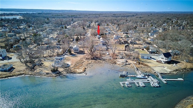 bird's eye view featuring a water view and a residential view