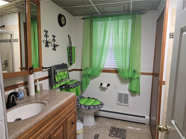 bathroom featuring vanity, a baseboard heating unit, an enclosed shower, toilet, and tile patterned floors