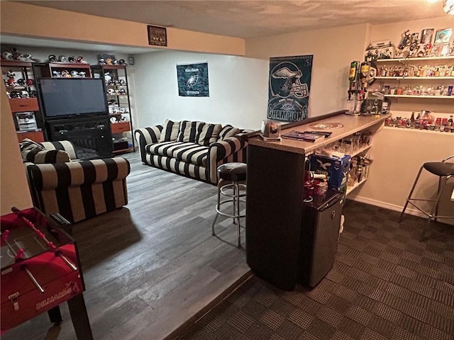 living room featuring a dry bar and wood finished floors