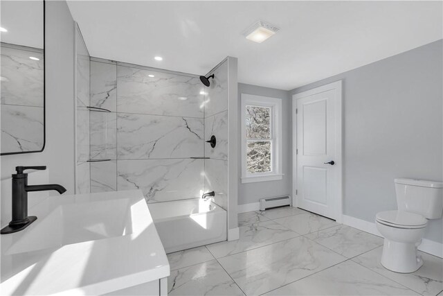 full bathroom with baseboard heating, toilet, tiled shower / bath combo, and sink